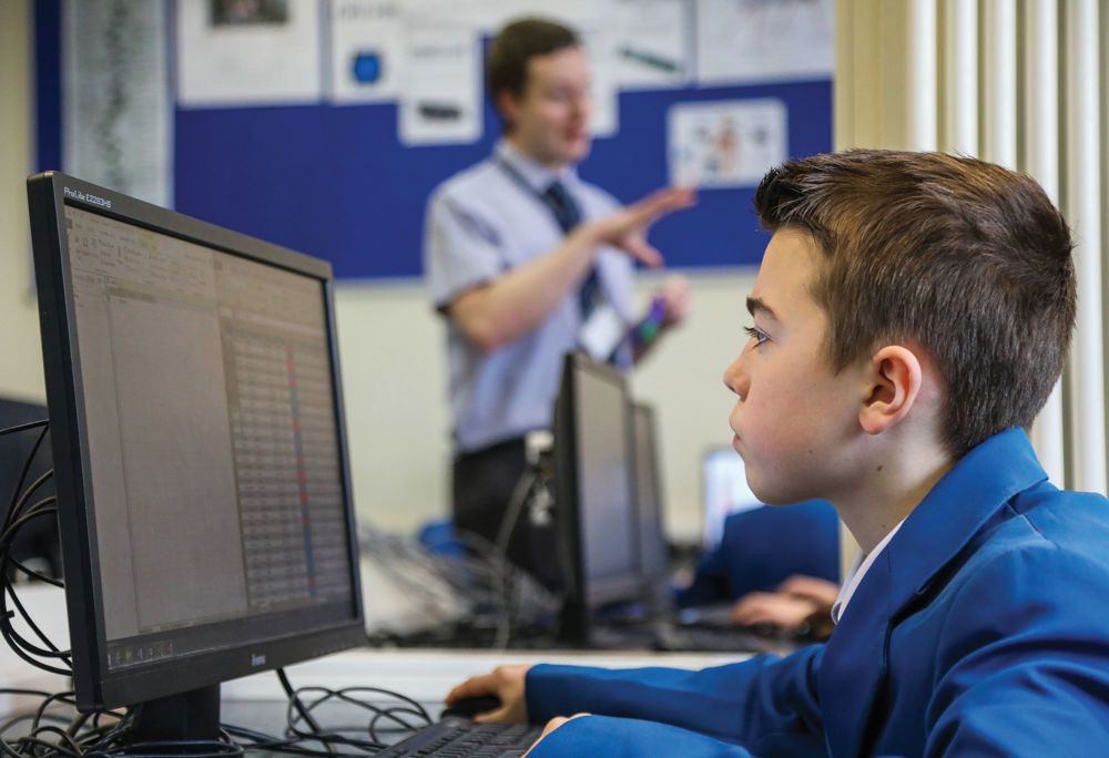 Pupil looking at a computer screen in a Computing lesson 