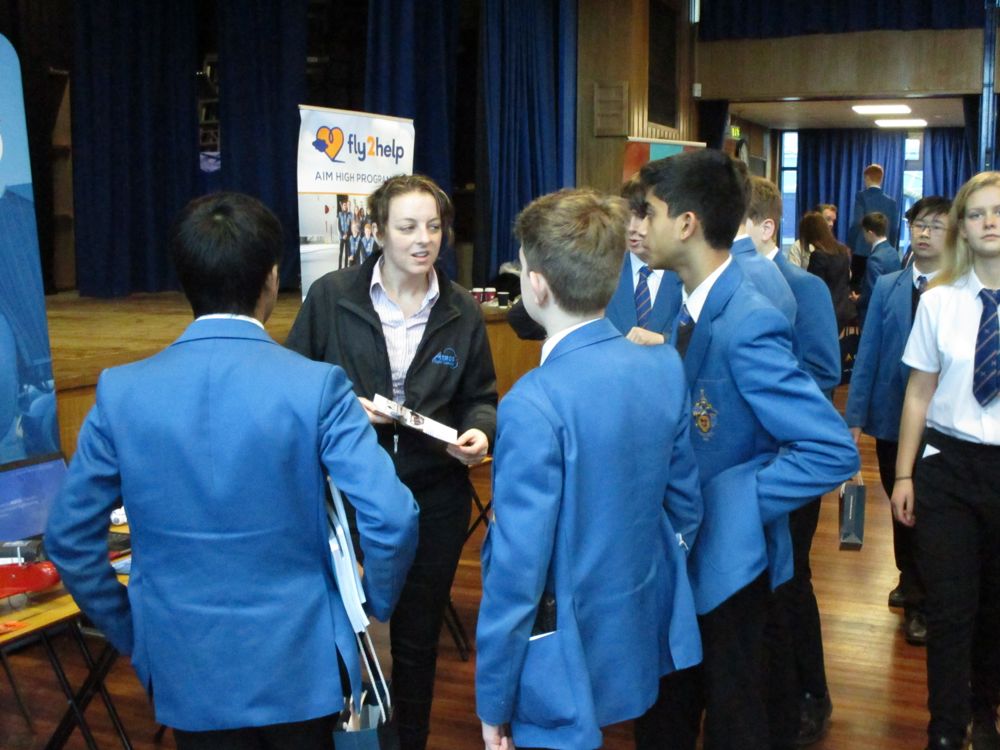 Pupils crowding around a stand at the Careers Fayre